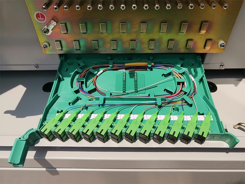 Lockable 24-fiber splice tray  inside outdoor distribution cabinet